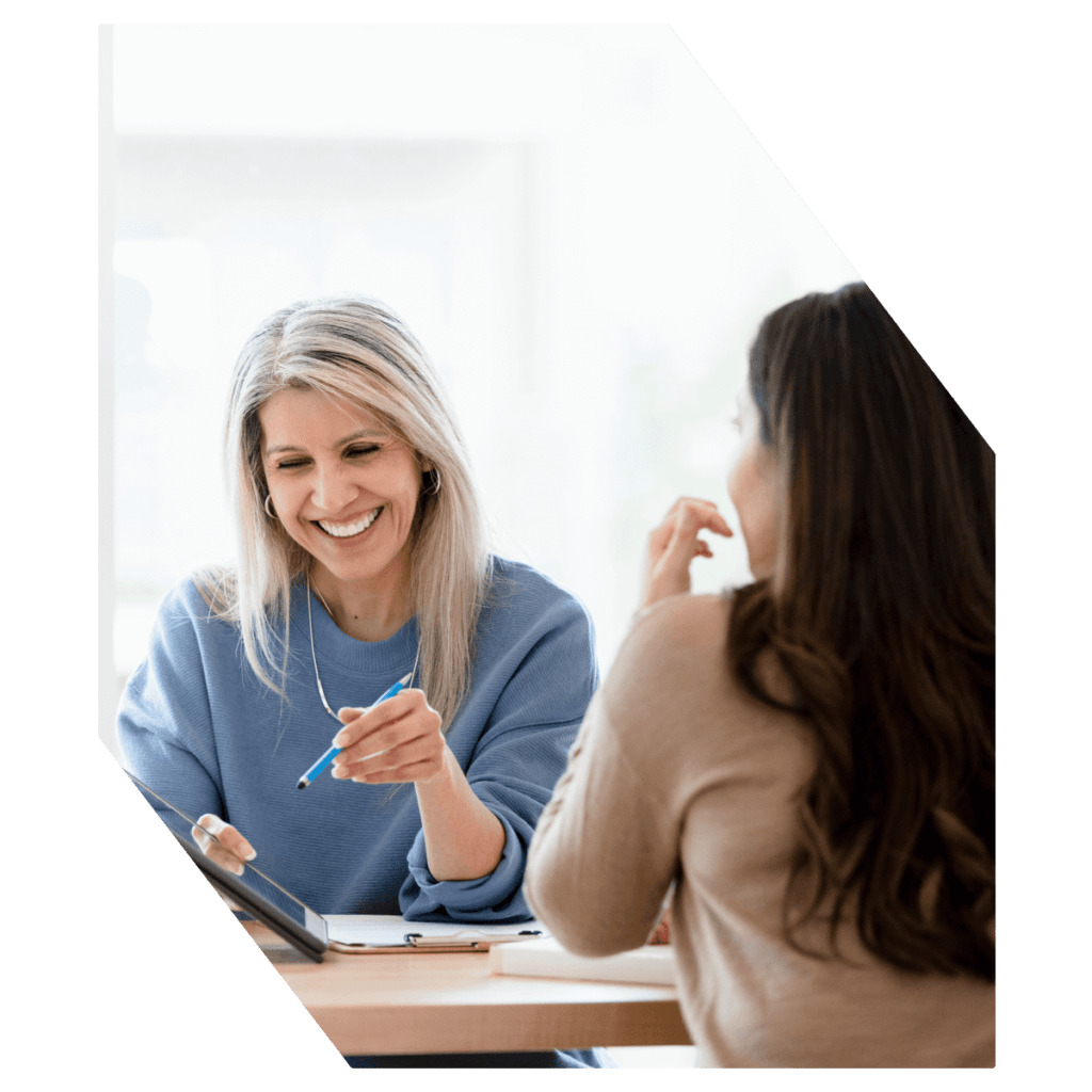 Women smiling in meeting